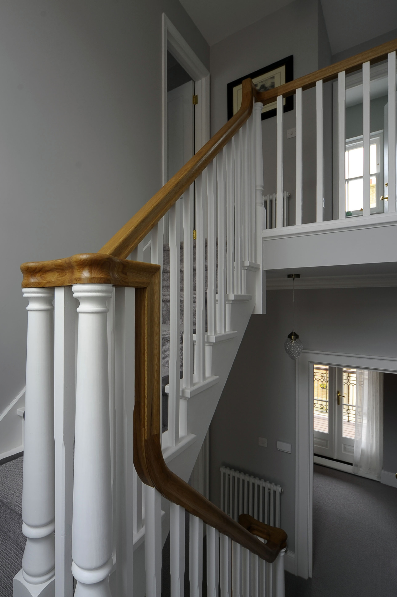 Cut string U-shaped stairs with iron baluster