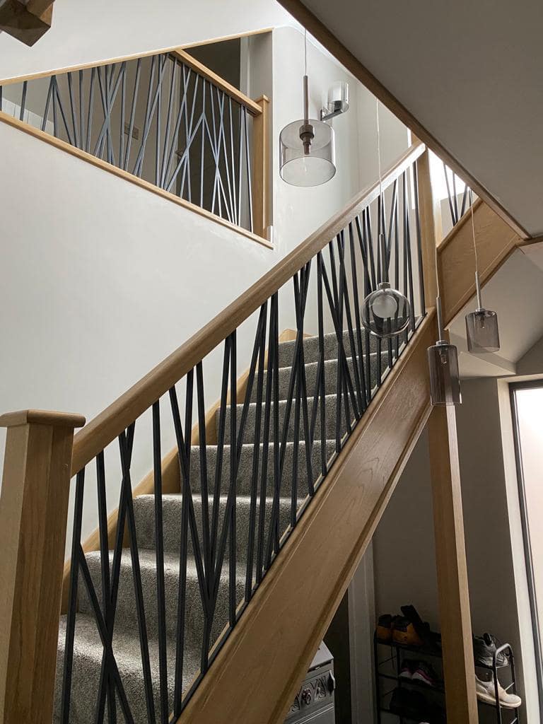 Staircase with crisscross metal spindles