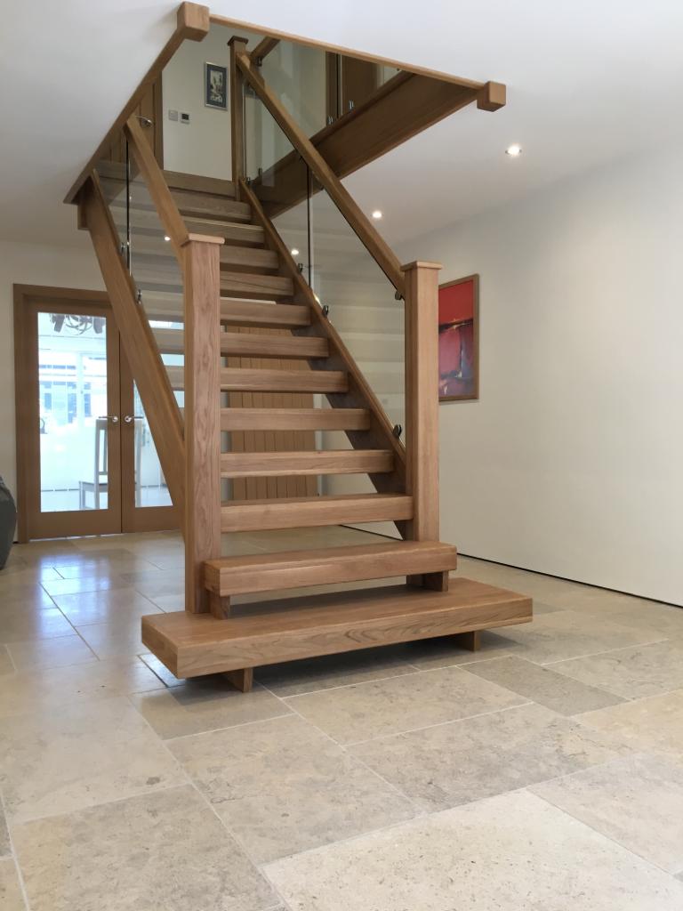 Open Riser staircase with glass balusters