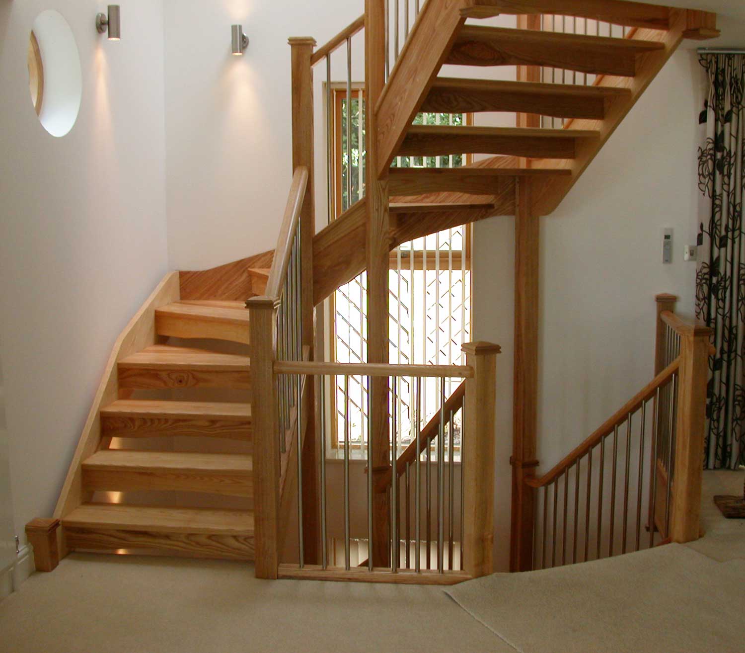 winding Open Riser staircase with metal spindles