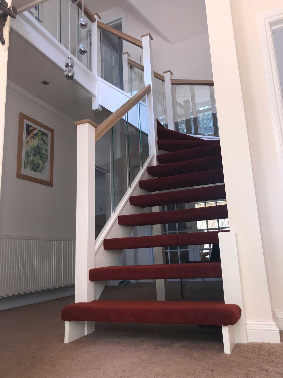 winding Open Riser staircase with glass baluseters