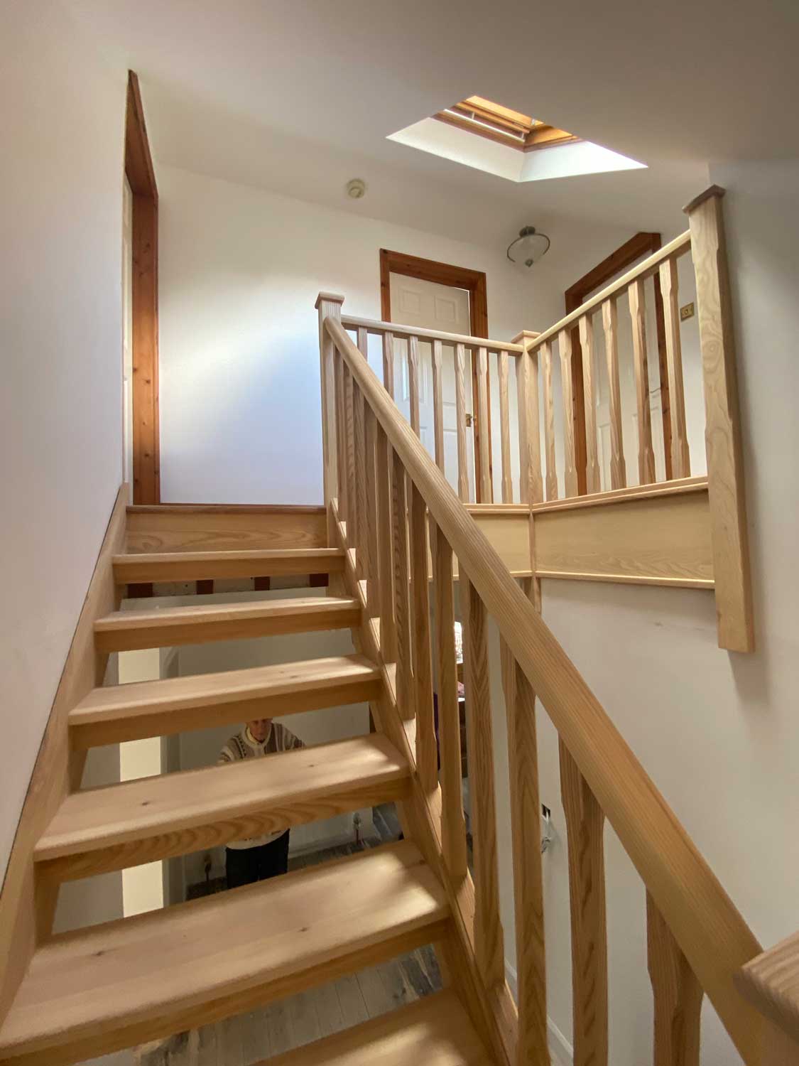 Contemporary Open Riser staircase with wooden balusters