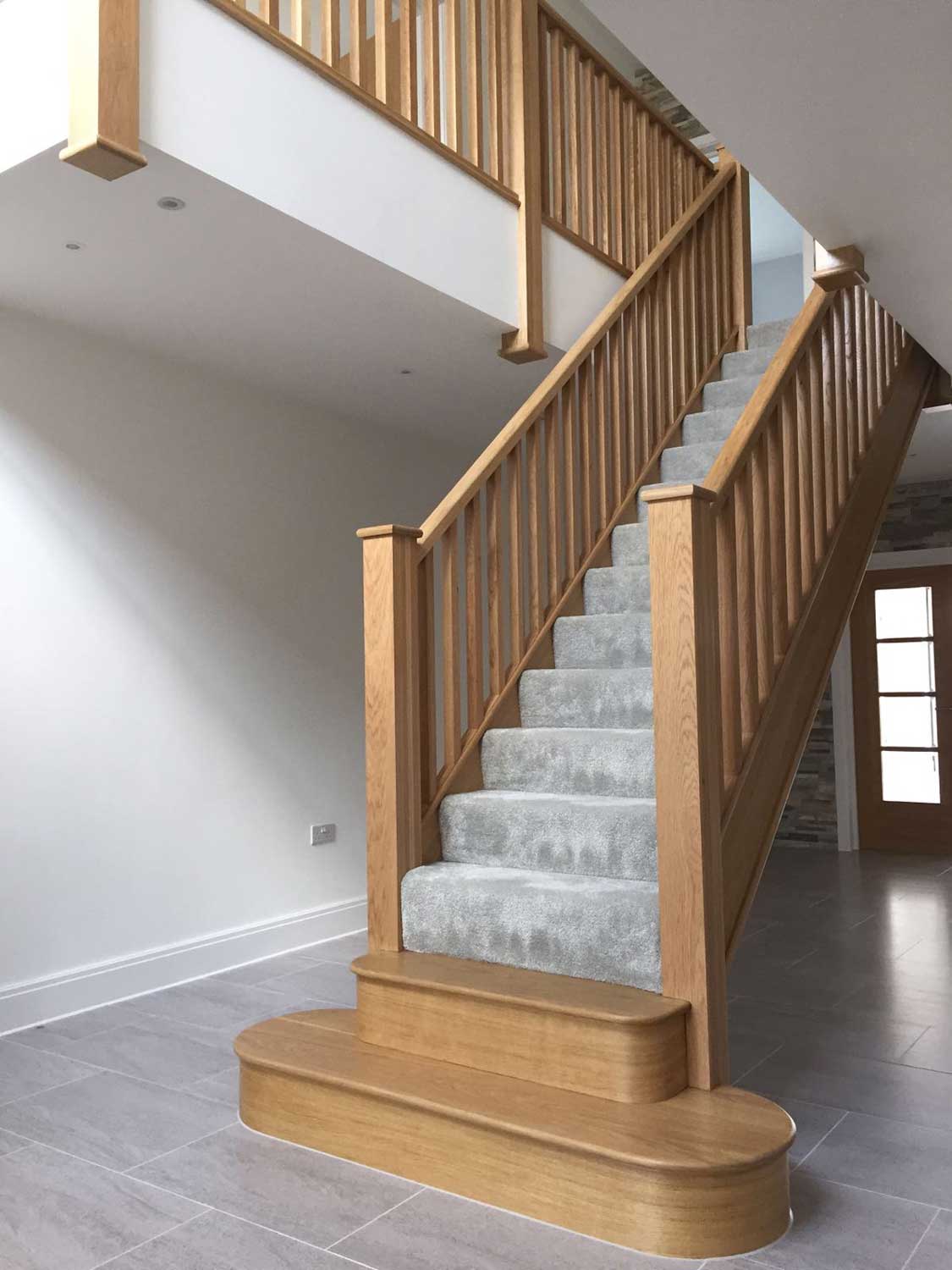 contemporary open rising staircase with Timber Spindles