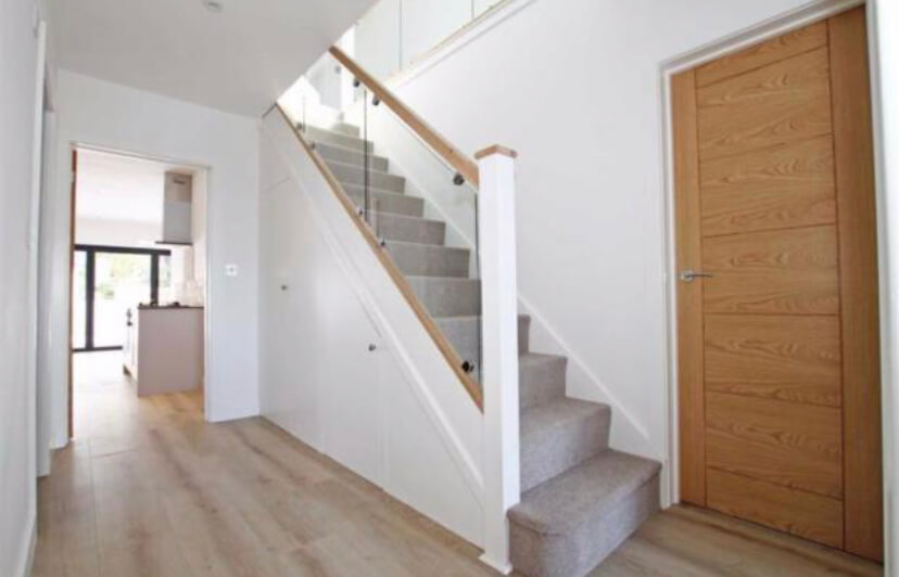 straight staircase with glass balusters