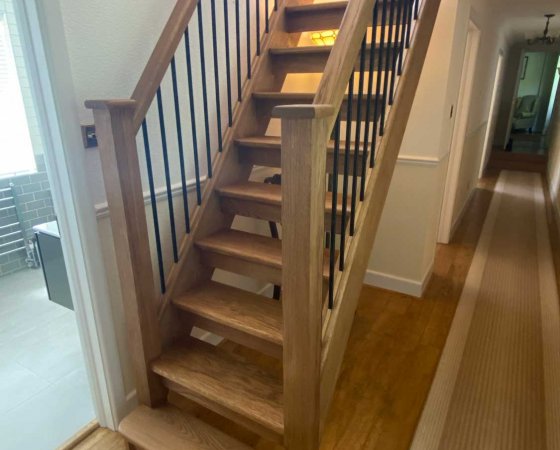 Wooden staircase with metal spindles