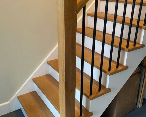 Bottom of the staircase with metal spindles