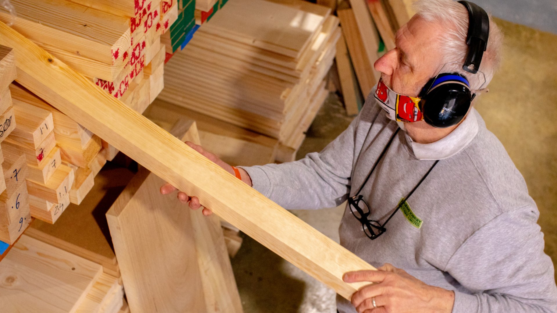 Staircase Conversion - man carrying wood